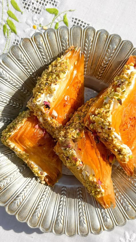 Radina Dickson 🎗 | Warbat- baklava triangles with cream and pistachios. Recipe: One packet of filo sheets 4 tbsp melted butter 1.5 cups simple syrup (made… | Instagram Baklava Plating, Baklava Inspired Desserts, Filo Pastry Recipes Sweet, Baklava Filling, Filo Recipes, Baklava Cookies, Filo Pastry Recipes, Persian Desserts, Trifle Dessert Recipes