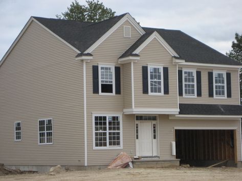 A creamy off-white or tan on the siding with navy shutters and front door would be spectacular. Description from houzz.com. I searched for this on bing.com/images Grey Siding White Trim, Tan Siding, Navy Shutters, Certainteed Vinyl Siding, Vinyl Siding Colors, Exterior Siding Colors, Tan House, Grey Siding, Shutter Colors