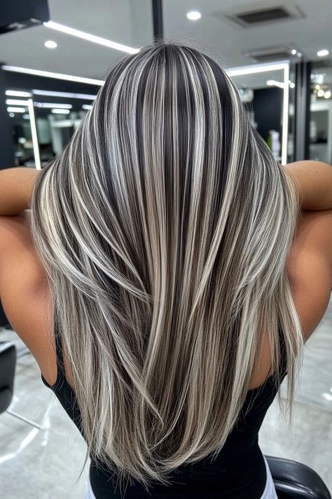 Woman with full platinum highlights on raven black hair. Town Hair With Blonde Highlights, Dark Hair With Bright Blonde Highlights, Dark And Platinum Hair, Black Blonde Hair Balayage, Black Roots With Blonde Hair, Dark Brown Lowlights In Blonde Hair, Blonde Hair Dark Highlights, Black And Ash Blonde Hair, Dark And Blonde Highlights