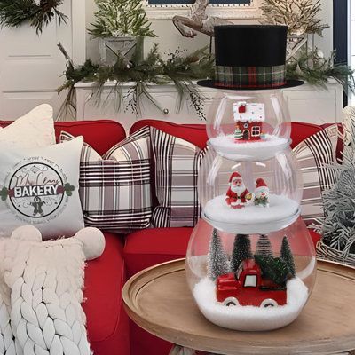 Package includes 3 fish bowls, 1 bag of fake snow, 4 Christmas trees, 1 Santa, 1 snowman, 1 red house, 1 red ceramic truck with tree, 1 black top hat. | The Holiday Aisle® Christmas Decorations Indoor - Christmas Decor - 3 Pack DIY Fish Bowl Snowman Crafts w / Fake Snow & Tree & Figures & Top Hat | Wayfair Snowman Fishbowl Christmas, Snowman Table Decorations, Diy Fish Bowl, Snowman Hat Centerpiece, Ceramic Truck, Fish Bowl Snowman, Bowl Snowman, Christmas Bazaar Ideas, Yule Tide