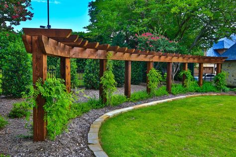 Frame the horizon with wood, wisteria and some classic climbing vines. Tuscan Patio, Curved Pergola, Wooden Arbor, Cheap Pergola, Garden Vines, Garden Arbor, Covered Pergola, Dry Creek, Pergola Plans