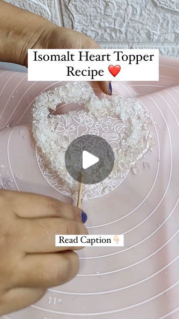 Pooja Chimurkar Ninawe on Instagram: "Isomalt Heart Topper Recipe 👇🏻 ✨Melt isomalt on gas. Once melt completely spread on silicon sheet wait for 4-5 min. And then it will set . Break into small pieces. ✨Again melt some isomalt and then spread in heart shape and add pieces over it , do this action fast bcoz isomalt set so fast. Also put toothpick so that we can hold topper on cake... ✨Apply golden dust at the corner and red and pink colour in centre part as shown in video. ✅Then use on cake as you want. #heart #heartcake #heartrecipe #isomaltheart #cakereels #cakevideo" Isomalt Decorations Tutorials, Isomalt Cake Topper, Isomalt Cake, Heart Cake Decoration, Heart Cake Topper, Cake Topper Tutorial, Heart Shaped Cakes, Heart Food, Sugar Paste