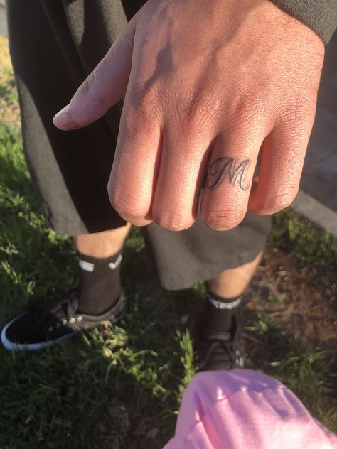 Finger Tattoos Ring Finger Tattoo, Mens Ring Finger Initial Tattoo, Initals Tattoo On Ring Finger, M Ring Finger Tattoo, Letter Tattoo On Ring Finger, M Ring Tattoo, T Finger Tattoo, Husband Ring Tattoo, Name Tattoo Ring Finger