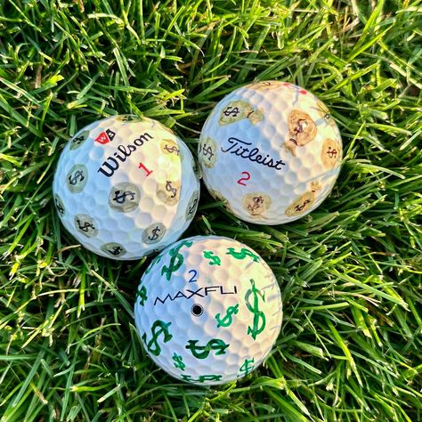 Discover a one-of-a-kind collection of hand-painted golf balls, each meticulously crafted to add a touch of artistic flair to your game. Perfect for players, collectors, enthusiasts, or as a distinctive gift idea.  Every ball is individually decorated  with intricate designs, ensuring no two are alike. Enhance your game with these functional pieces of art that combine craftsmanship with creativity. Ideal for golfers who appreciate both performance and aesthetics.  *Please note: Balls used are pr Golf Ball Painting Ideas, Decorating Golf Balls For Boyfriend, Decorating Golf Balls, Custom Golf Balls, Golf Ball Designs Sharpie For Boyfriend, Drawing On Golf Ball Ideas, Decorated Golf Balls, Golf Ball Designs Sharpie, Painted Golf Balls