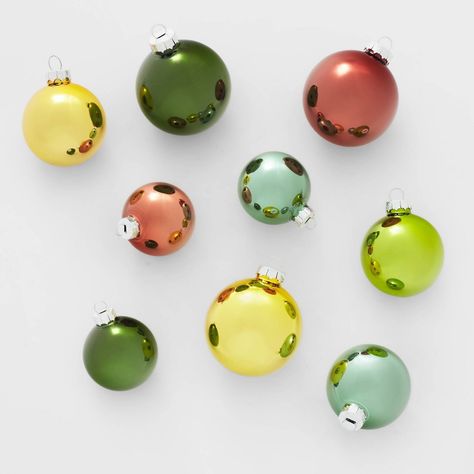 Get a versatile option for styling your holiday tree with the 42-Count Round Glass Christmas Tree Ornament Set from Wondershop™. This set includes 42 ball ornaments handcrafted from glass in a variety of colors. The simple design makes them easy to pair with a wide variety of ornaments, lights and garlands, and they're equipped with top metal loops that you can attach hooks to for easy hanging. Wondershop™: Welcome to the Wondershop. Oversized Ornaments, Yellow Ornaments, Mid Century Modern Christmas, Retro Christmas Tree, Mid Century Christmas, Glass Christmas Tree Ornaments, Woodland Christmas, Ornament Hooks, Christmas Ornament Sets