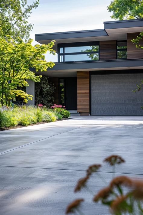 Modern Concrete Driveway Ideas for Stylish Curb Appeal Modern House Driveway, Driveway Stone Ideas, Modern Driveway Ideas Concrete, Modern Driveway Landscaping, Concrete Driveway Extension Ideas, Curved Driveway Ideas, Modern Driveway Design, Modern Driveway Ideas, Concrete Driveway Ideas