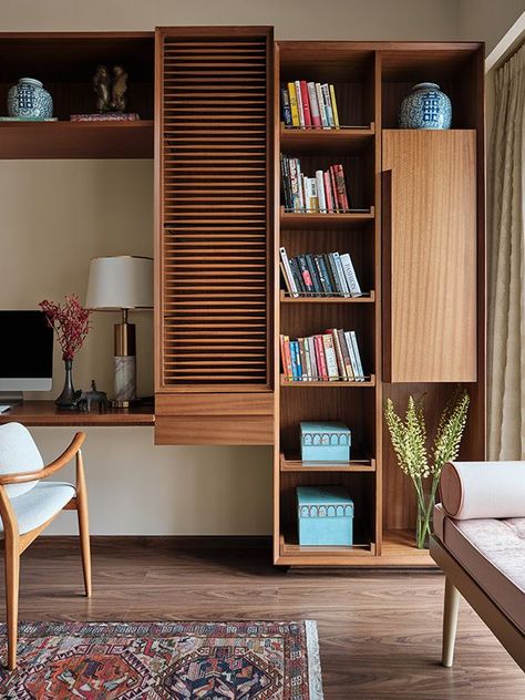 A focus on craftsmanship flows through the home and into the study with its custom unit crafted from wood and brass Image Credits: Gokull Rao Kadam Styling Credits: Sameer Wadekar Study Room Design Indian, Study Table Designs With Storage, Study Table Bookshelf, Study Unit With Wardrobe, Indian Study Table, Room With Study Table, Indian Study Room, Study Unit Designs In Bedroom, Study Table Design Bedroom