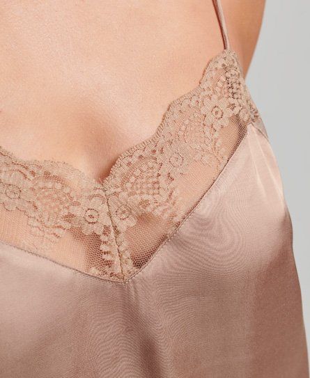 Delicate lace and spaghetti straps add to the feminine air of the Satin Cami top. Crafted in a beautiful satin fabric and designed to flow with your movement, layer this cami to create an outfit as unique as you are. Relaxed fit – the classic Superdry fit. Not too slim, not too loose, just right. Go for your normal size Delicate spaghetti straps Floral pattern lace trim Subtle Superdry branding Silk Night Dress, Satin Cami Top, Satin Cami, Cami Top, Cami Tops, Satin Fabric, Night Dress, Lace Trim, Spaghetti Strap