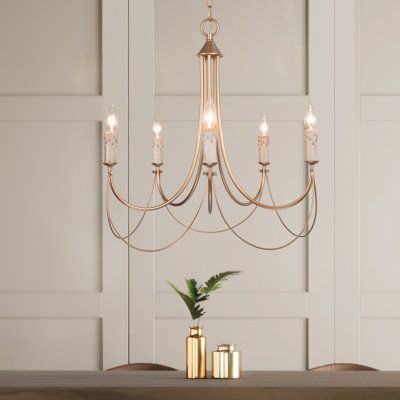 This 5-light unique drum rose gold chandelier would renovate your space with a modern contemporary and glam touch. Five arms smoothly drape down and curve upside for an elegant and streamlined outlook. The classic candelabra bases give a retro feeling that brings you back to the aristocracy time. The warming glow from five bulbs(not included/up to 40W) will create an instant romantic ambiance over your dining table, kitchen island, living room, bedroom, or anywhere else. Just embrace this modern Modern Gold Chandelier, French Country Chandelier, Country Chandelier, Dining Room Light Fixtures, Room Chandelier, Candle Style Chandelier, Chandelier Bedroom, 5 Light Chandelier, Traditional Chandelier