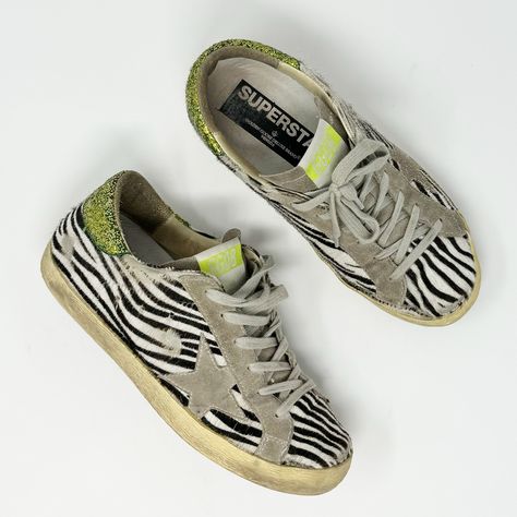 Golden Goose Deluxe Brand Ggdb Zebra Pony Hair Low Superstar Sneaker Green Glitter Heel Eu 37 Low Top Sneakers From Golden Goose. Gently Used Condition. Pony Hair With Zebra Print. Leather Upper. Green Glitter Detail On Heel. Lace Up Sneaker. Wear Present Including Creasing And Wear On The Pony Hair And Wear On The Bottom Soles. Wear Also Present On Inner Soles. Golden Goose Is Intentionally Distressed. Tags: Distressed, Distressing, Animal Print, Leopard, Cheetah, Zebra, Safari, Jungle, Statement Piece, Casual, Low Top, Casual, Comfortable, Comfy, Fashion Sneakers, Round Toe, Lace Up, Laces, Luxury Safari Jungle, Glitter Heels, Golden Goose Deluxe Brand, Pony Hair, Star Sneakers, Green Glitter, Comfy Fashion, Golden Goose, Fashion Sneakers