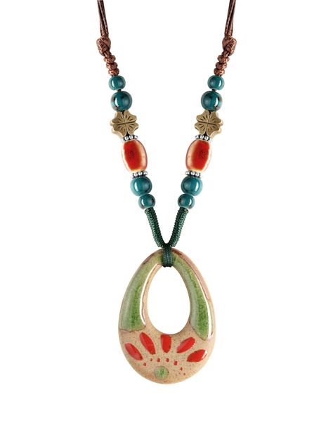 PRICES MAY VARY. UNIQUE DESIGN: Discover the unique charm of this bohemian necklace, featuring a handcrafted ceramic pendant with an abstract nature-inspired design, perfect for adding a touch of artistic flair to your jewelry collection. VIBRANT CERAMIC & METAL BEADS: Adorned with a harmonious blend of polished ceramic beads in earthy green and fiery orange hues, and accented with antique bronze leaf charms, this necklace celebrates the spirit of Mother Nature. ADJUSTABLE CORD: The sturdy, intr Ceramic Jewelry Ideas, Aesthetic Clay Jewelry, Clay Necklace Ideas, Jewellery Ceramic, Hippy Necklace, Nature Ceramics, Clay Charm Necklace, Clay Necklace Pendant, Crafts Aesthetic