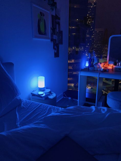 room with blue ambient blue lighting and floor to ceiling windows looking into the city Blue Room Asthetics, Downtown Asthetics, Apartment Asthetics, Board Ideas For Bedroom, Vibe Room Ideas, Bulletin Board Ideas For Bedroom, Room Asthetics, Pretty Architecture, Lighting References