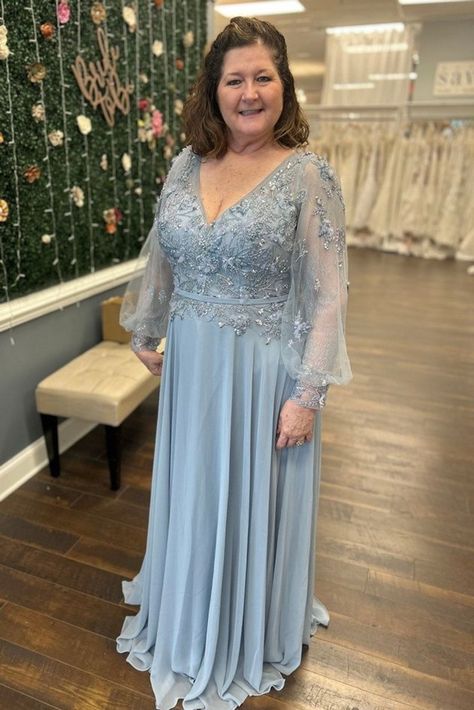 Dusty blue a-line chiffon mother of the bride dress, mother of the groom gown and wedding guest outfit with lace long sleeve blouson and silver appliques | Mother of the Bride Dresses — Savvi Formalwear&Bridal | Raleigh, North Carolina Wedding Dresses Mother Of The Groom Blue Dresses, Dusty Blue Mother Of The Bride Dress Long, Silver Mother Of The Bride Dress, Mother Of Bride Blue Dress, Mother Of The Bride Blue Dress, Mother Of The Bride Dress Blue, Mother In Law Dresses For Wedding, Light Blue Mother Of The Bride Dress, Dusty Blue Mother Of The Bride Dress