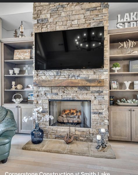 Stone Fireplace And Tv Wall Ideas, Stone Fireplace To Ceiling With Tv, Hidden Room Behind Fireplace, Rock Fireplace Built Ins, Rock Wall With Tv And Fireplace, Brown Couch With Rug Ideas, Stacked Stone Fireplace With Built Ins On Both Sides, Stack Stone Fireplace With Built Ins, Grey Stone Fireplace With Built Ins