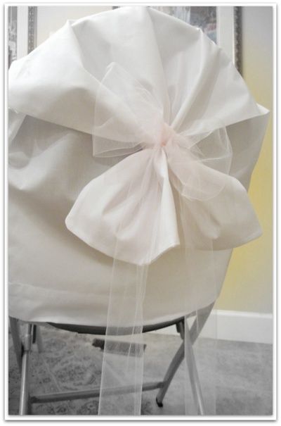 Anyone who has thrown a semi-formal party or planned a wedding knows that chair covers are a huge cost.  I'll let you in on a secret.  Pillowcases. Chair Covers For Wedding, Cheap Chair Covers, Diy Chair Covers, Chair Covers Party, Chair Back Covers, Folding Chair Covers, Metal Folding Chairs, Party Chairs, Cheap Chairs