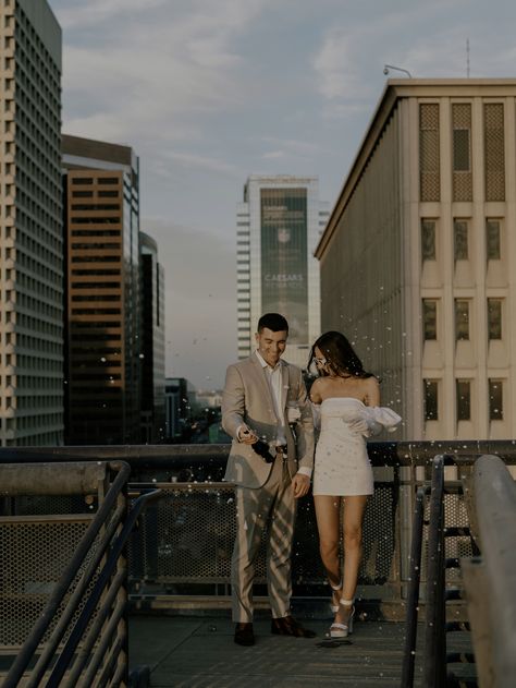 Champagne Engagement Pictures, White Bridal Suit, Modern Engagement Photos, Bride Sunglasses, Popping Champagne, Bridal Sleeves, Pasadena City Hall, Downtown Photography, Engagement Photo Outfit