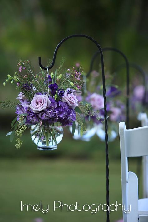 Purple Garden Flower Look in Shepherd's Hook Shades Of Purple Wedding Centerpieces, Wedding Arch With Purple Flowers, Purple Rain Wedding Theme, Outdoor Purple Wedding, Lavender And Green Wedding Centerpieces, Lavender And White Wedding Decoration, Purple And Green Wedding Table Settings, Dark Green Light Purple Wedding, Light Purple Wedding Theme Decor