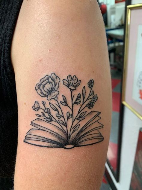 Floral Book Tattoo Design, Book Tattoo Ideas Thigh, Book Thigh Tattoo, Book Plant Tattoo, Booktok Tattoos, Small Book Tattoo, Tattoos For Readers, Bestie Tats, Reading Tattoo