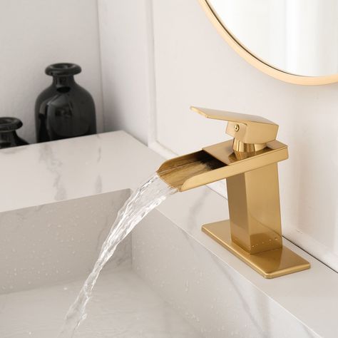 Finished in matte brushed gold tone, this faucet adds an elegant touch to the bathroom, and the single-lever design makes it easy to control water temperature and volume with one hand. Gold Faucet Bathroom, Gold Bathroom Sink Faucet, Gold Sink Faucet, Gold Bathroom Sink, Gold Bathroom Fixtures, Bathroom Sink Faucets Modern, Gold Bathroom Faucet, Master Bath Design, Gold Faucet