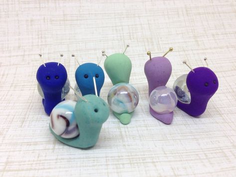 These handmade polymer clay marble snails are so cute! They would make a great gift for the snail or marble collector you know. They can live on your desk, windowsill, in a plant, in a fairy garden, or anywhere else you can think of! Choose your favorite color for maximum loving! Glitter snails are available in another listing. All snails will be custom and handmade so they will vary from the pictures. I will chose what marble I think looks best with your selections. The snail in the thumbnail i Snail Fairy, Clay Moulding, Garden Miniature, Clay Fairies, Polymer Clay Christmas, Easter Gifts For Kids, Polymer Clay Animals, Cute Polymer Clay, Clay Ornaments