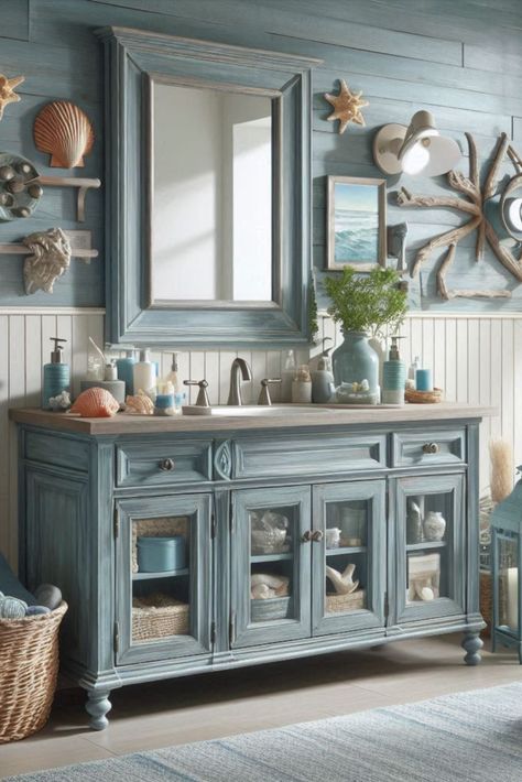 Bring beachy vibes to your bathroom with this weathered blue vanity. Perfect for a coastal-themed retreat. #CoastalDecor #BeachHouseStyle Bayou Cottage, Blue Vanity, Beach Theme Bathroom, Vanity Ideas, Beachy Vibes, Beach House Style, Kids Bathroom, Kids' Bathroom, Coastal Decor