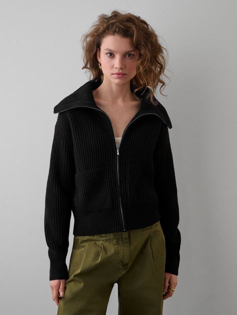 Ethically produced and responsibly sourced, our new Merino Blend Ribbed Zip Up Jacket offers a great new weight and texture to our transitional knitwear collection. With a cropped silhouette, our Zip-Up Jacket feels very much like a bomber style, with side pockets and a neckline that can be zipped up like a turtleneck or left open with a ribbed collar shape. Details Straight fit. Long sleeve. Length in size small is 21". The model is 5'11" and is wearing a size small. 55 % RWS Superfine Merino, Light Taupe Color, Terry Richardson, Boxy Sweater, Zip Collar, Sweater Oversize, Zip Cardigan, Collar Cardigan, Womens Cashmere, Raw Denim