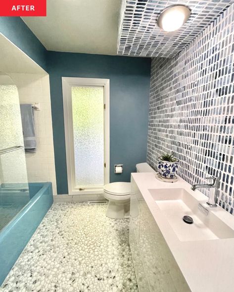 Blue Bathtub Bathroom Ideas, Blue Tub Bathroom Ideas, White Wallpaper Accent Wall, Pebble Flooring, Deep Blue Paint, Karen Graham, Blue Bathtub, Diy Remodeling, Blue Bathroom Tile