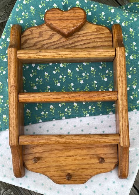 Adorable  wood shelf with heart shaped motif! This would be perfect in your kitchen as a spice rack, as part of a wall gallery to incorporate smaller trinkets, or as a display rack for your crystal collection! The little pegs also make it a great addition to a bathroom to hold necklaces and bracelets, or even your vintage hats and scarves. Wooden Shelf With Hooks, Spice Rack Vintage, Hold Necklaces, Vintage Spice Rack, Shelf Spice Rack, House Fever, Witch Room, Sleeping Quarters, Thrifted Home