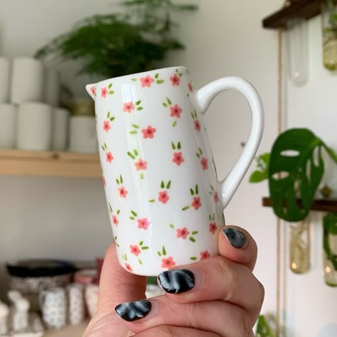 Just a teeny little pink floral jug ✨🌸 Lots of things available on my website now - link in bio ✨🥰 #art #artist #ceramics #pottery #painting #illustrator #ceramicstudio #potterytiktok #potterypainting #painter #dinosaur #spotty #smallbusiness Pottery Painting Ideas Jug, Jug Pottery Painting Ideas, Hand Painted Pottery Vase, Ceramic Jug Painting Ideas, Pottery Painting Teapot, Pottery Painting Jug, Pottery Painting Designs Vase, Jug Painting Ideas, Vase Ceramic Design