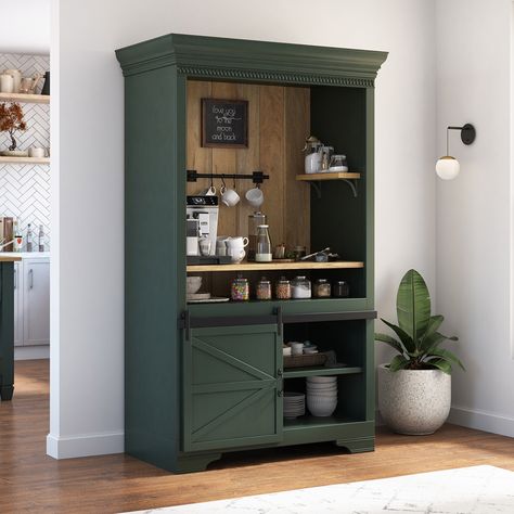 For a cozy and aesthetic touch to your interiors, bring our ergonomically designed Sherbrooke Solid Wood Barn Door Farmhouse Coffee Bar Hutch. With its charming design and ample storage space, it's a must-have for any coffee lover. Entirely handcrafted from solid wood, this beautiful coffee bar hutch boasts a 2-tone outlook that blends the charm of the rustic texture of solid wood with a hand-applied dark finish, resulting in a visually stunning design. In addition to its attractive look, the pi Bookshelf Turned Coffee Bar, Forest Green Coffee Bar, Green Coffee Bar Ideas, Dark Green Coffee Bar, Farmhouse Bar Cabinet, Armoire To Coffee Bar, Wardrobe Coffee Bar, Coffee Bar Colors, Coffee Bar Building Plans