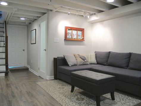 Finished small and shallow basement - Tiled floors, exposed beams painted white, and BM pale oak paint. Chic Basement, White Basement, Small Basement Design, Basement Ceiling Options, Basement Painting, Small Basement Remodel, Pale Oak, Basement Layout, Tiled Floors