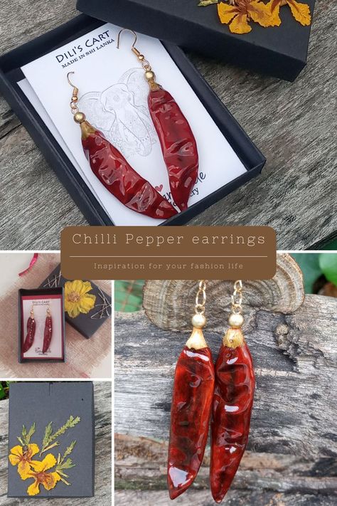 These absolutely divine Resin Christmas chilli pepper earrings are sure to get you celebration the Christmas season!

The chilli pods are completely covered in resin and a gold bead is added for decoration. This pair of earrings is made to highlight the unique red color of the chilli pods and can be worn for any occasion you like. Make the natural color of a natural pod your style. Resin Christmas Earrings, Christmas Resin Earrings, Chilli Earrings, Nature-inspired Handmade Resin Earrings, Artistic Red Resin Jewelry, Pepper Earrings, Red Resin Drop Earrings, Orange Resin Dangle Earrings, Violet Jewelry