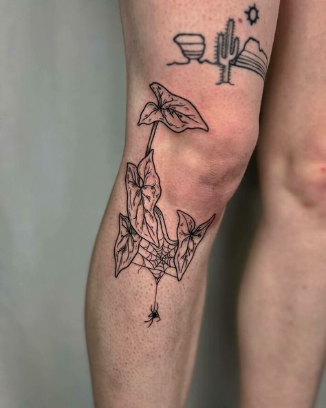 An arrowhead vine around the knee with a spider tattoo Knee Dotwork Tattoo, Top Of The Knee Tattoos Women, Knee Dragon Tattoo, Matching Above Knee Tattoo, Modern Floral Tattoo, Sick Knee Tattoos, Neo Trad Knee Tattoo, Front Of Shin Tattoo, Vine Kneecap Tattoo