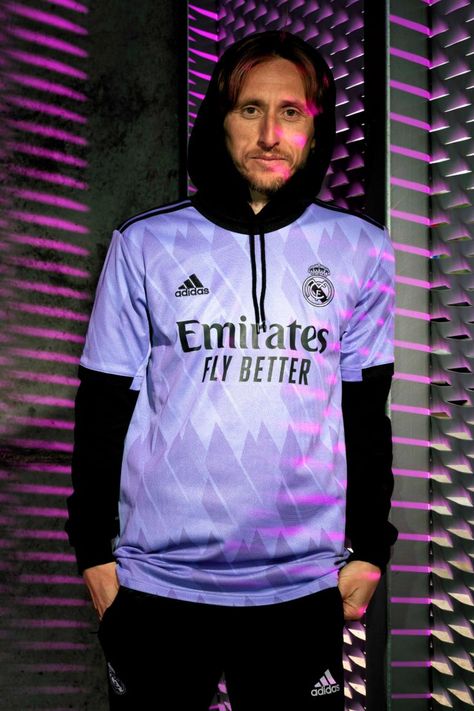 Using a famous Real Madrid coloway, adidas sets out on the new Real Madrid away jersey to capture the most precious prematch moment that every player and fan experiences. The height of anticipation, the growing excitement, the rush of adrenaline that gets everyone’s blood pumping. Moments like these drive the players and fans forward and in this progressive graphic design and colorway, Real Madrid will be doing just that. Real Madrid Purple, Real Madrid Jersey, Best Soccer Shoes, Madrid Jersey, Real Madrid Shirt, Adidas Set, Luka Modric, Soccer Shop, Soccer Kits