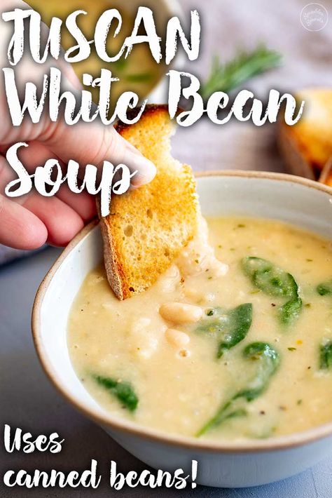 This Easy Creamy Tuscan White Bean Soup is pure comfort food. Warming, delicious, healthy soup that tastes rich and creamy despite the lack of heavy cream. Rosemary, garlic, and parmesan give this the authentic Tuscan flavor, while the canned beans mean it is a sinch to make, ready in under 20 minutes this is the perfect bowl of soup for winter nights when you need a quick and easy meal for the whole family. Northern Beans Soup Recipe, Recipes For Great Northern Beans, Recipes Using Canned Great Northern Beans, Recipes With Great Northern Beans, Canned Northern Bean Recipes, Canned Great Northern Beans Recipe, White Northern Beans Recipes, Northern White Beans Recipes, Tuscan Beans Recipe