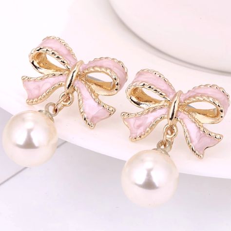 These Pink Bow Pearl Earrings Offer A Unique And Stylish Look That Will Make Any Outfit Stand Out. Crafted From A Pink Bow Design And Detailed With A Beautiful Pearl, They Are An Eye-Catching Accessory That Will Take Your Look To The Next Level. With A Lightweight Feel, These Earrings Are Comfortable To Wear All Day Long. The Perfect Finishing Touch To Any Girly Look, These Pink Bow Pearl Earrings Are Sure To Turn Heads. Get It Fast With 1-3 Day Priority Mail Shipping. Orders Are Packed & Shippe