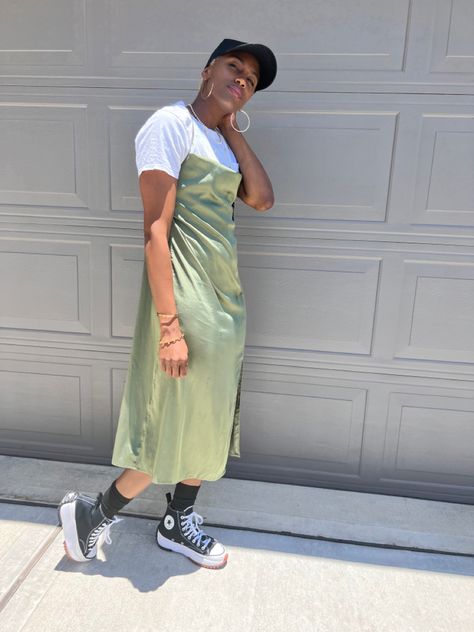 Casual Fit- green slip dress with white under, black socks, platform converse, black 1 hat #blackgirlfashion Slip Dress Sweatshirt, Slip Dress With Shirt Under, Dress With T Shirt Underneath, Spaghetti Dress With Shirt Under, Dresses With Tshirts Under, T Shirt Under Dress Outfits, Tshirt Under Dress Outfit, Green Slip Dress Outfit, Tshirt Under Dress