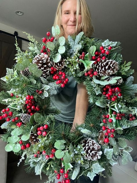 For holiday decorating, a custom faux Christmas wreath crafted from natural balsam serves as the ideal artificial home decor, perfect for adding festive charm to the front door during holiday parties and celebrations. DETAILS  🌲Wreath measures 20" Depth 8" 🌲High quality faux Balsam 🌲Variety of high quality faux Greens we do our best to match exactly what is pictured.  🌲White tip or natural pinecones  🌲Wreath can be outside but longevity may be affected  🌲Standard shipping is free 🌲Shippin Bow Wreaths, Christmas Wreath Designs, Outdoor Christmas Wreaths, Large Christmas Wreath, Christmas Wreath Craft, Holiday Wreaths Christmas, Artificial Christmas Wreaths, Easy Christmas Wreaths, Christmas Front Doors