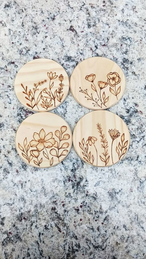 This is a 4 inch round, wood burned wildflower themed coaster set. This set contains different wildflowers burned onto them. These are hand-burned, then sealed with a clear matte polycrylic. They have a cork backing to prevent scratching. The thickness of each coaster is 1/4 inch. Wood Burned Flowers Simple, Burn Pen Ideas, Wooden Engraved Coasters, Wood Coasters Ideas, Wood Burned Sunflower, Wood Engraving Patterns, Wood Burned Coasters Ideas, Wood Burned Sign, Wood Burn Designs Easy