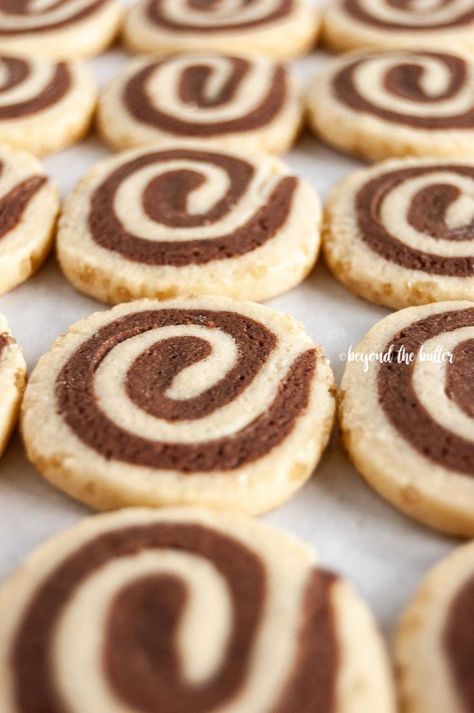 Chocolate Pinwheel Cookies are perfect to make over the holidays! They're a combination of chocolate cookie dough and vanilla cookie dough rolled together into a beautiful swirl, then rolled in demerara sugar for a bit of sweet crunchiness on the outside! They taste fantastic and a definite must make! | Recipe over on www.BeyondtheButter.com | #holidaycookies #pinwheelcookies #cookies #beyondthebutter Pinwheel Cookie Recipes, Chocolate Pinwheel Cookies, Log Cookies, Vanilla Cookie Dough, Holidays Treats, Pinwheel Cookies Recipe, Swirl Cookies, Demerara Sugar, Icebox Cookies