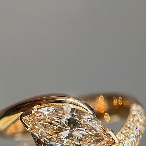 CADETTE on Instagram: "Introducing — CHAMPAGNE Adorned Pavé Marquise Rapture Ring 💎  A new, further embellished edition of our best-selling Marquise Rapture Ring. She’s a wearable art piece and absolute show-stopper, embodying a soulful warmth and elegance. Showcasing a brilliant CHAMPAGNE marquise cut diamond set within our Adorned Rapture design: an ocean-inspired silhouette with one side illuminated by shimmering white diamonds, creating an asymmetrical allure. A true modern heirloom that makes for an artful engagement ring that is bold and breath-taking.  — Champagne Diamonds are natural diamonds with an elegantly blushing, brown or golden undertone. Created by mother nature with variation and nuance, each diamond is one-of-a-kind. A champagne diamond makes for a stunning choice for t Luxury Marquise Yellow Gold Cluster Ring, Luxury Marquise Yellow Gold Diamond Ring, Luxury Unique Marquise-shaped Jewelry, Champagne Marquise Diamond Ring, Rapture Ring, Marquise Cut Rose Diamonds Fine Jewelry, Jewellery Website, Jewelry Website, Website Banner