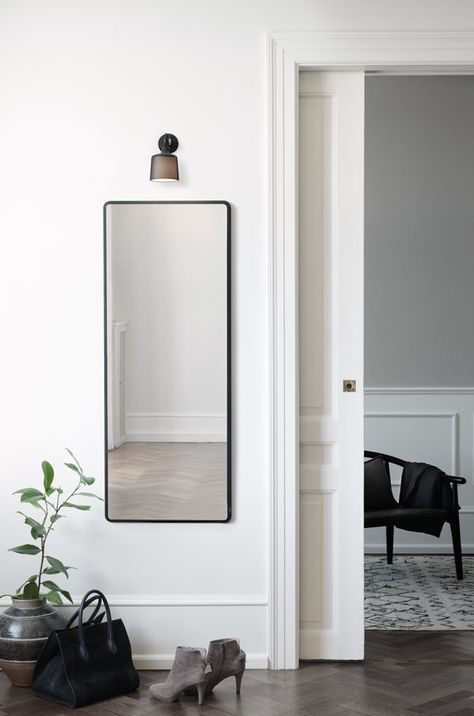 Small wall spot light designed by Vipp, made from powder coated perforated aluminium. Love the placement of the light about this minimalist hallway mirror. Light Over Mirror, Hallway Mirror, Black Wall Lamps, Scandi Design, Indoor Gardening, Small Wall, Scandinavian Interior, Dance Studio, Minimalist Living Room