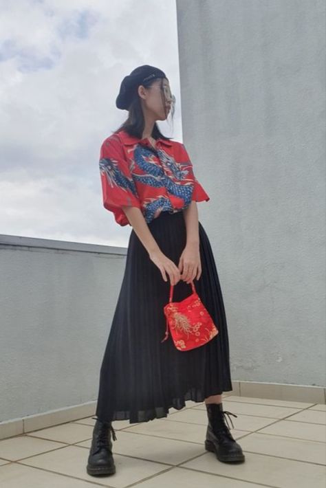 Look cool and edgy this Chinese New year with these outfit ideas! Long Skirt Dr Martens Outfit, Boot And Long Skirt Outfits, Red Top With Black Skirt, Long Black Skirt And Boots Outfit, Chinese New Years Outfit, Dr Martens Red Boots Outfit, Boots Long Skirt Outfit, Chinese New Year Outfit Casual, Chinese Skirt Outfit