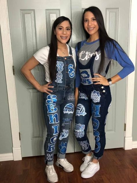 Home made Homecoming overalls Blue and white Homecoming Overalls Ideas, Homecoming Jeans Ideas, Homecoming Overalls, School Spirit Outfit, Senior Painted Jeans, Spirit Pants, Senior Year Things, Senior Year Fun, Texas Homecoming Mums