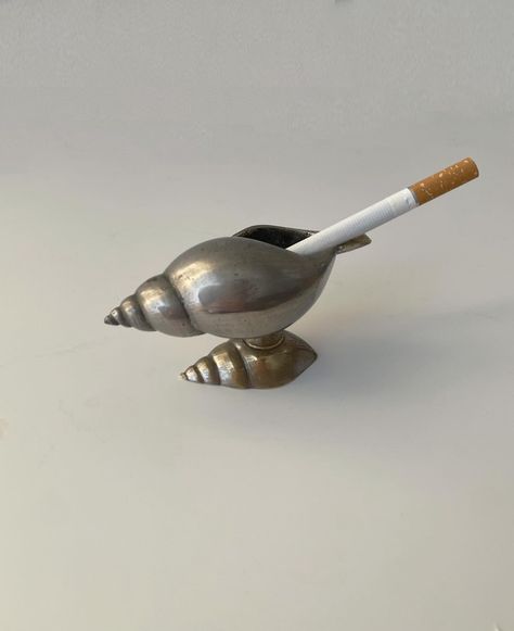 SOLD Metallic #Ashtray in #Shell form with silvering 1970s Found in Napoli, Italy In good vintage condition #1970svintage #vintageashtray Ashtray Aesthetic, Vintage Trinkets, Vintage Ashtrays, Napoli Italy, Weird Vintage, Pottery Inspo, Chefs Table, Vintage Ashtray, Ash Tray