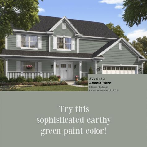 Acacia Haze 9132 SW paint color is an earthy green shown here on a house exterior - Hello Lovely. #acaciahaze #greenpaint Acacia Haze Sherwin Williams Exterior House, Best Green House Colors, Sw Acacia Haze Exterior, Acacia Haze Exterior House, Sherwin Williams Acacia Haze Exterior, Acacia Haze Exterior, Grey Green House Exterior, Acacia Haze Sherwin Williams Exterior, Green Painted House Exterior