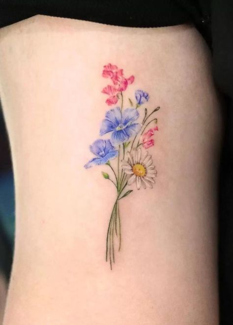 The Meaning of Daisy Tattoos: A Guide to Interpretations Violet And Sweet Pea Tattoo, Sweet Pea Tattoo With Name, Daisy And Violet Bouquet Tattoo, Sweet Pea And Daisy Tattoo Birth Flowers, Sweat Pea And Daisy Flower Tattoo, Daisy And Cosmos Tattoo, Daisy Sweet Pea Tattoo, Daisy And Violet Tattoo, Daisy And Sweet Pea Tattoo Birth Flower