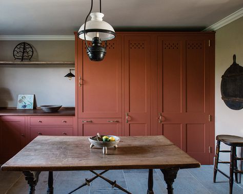 Brick Red Kitchen Cabinets, Red Shaker Kitchen, Rust Kitchen Cabinet, Red Earth Farrow And Ball Kitchen, Rust Kitchen Cabinets, Red Cabinets Kitchen, Terracotta Kitchen Cabinets, Kitchen Concrete Floor, Montreal Apartment