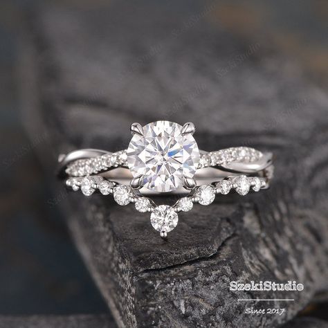 "White Gold Moissanite Engagement Ring Bridal Set Twist Infinity Solitaire Diamond Half Eternity Ring Bridal Women Promise Anniversary 2pcs Link for the main ring only: https://www.etsy.com/listing/623426001 Link for the same design with moonstone: https://www.etsy.com/listing/737678010/moonstone-bridal-set-white-gold?ref=shop_home_active_14&frs=1 ITEM INFORMATION Metal Type - Solid 14k Rose Gold Band Width - (approx. 2.3mm) Engagement Ring** Center Stone - 7mm Moissanite, Round Cut Clarity Wedding Bands For Infinity Rings, Elegant Engagement Rings Set, Twisted Engagement Rings With Wedding Band, Wedding Rings Engagement With Band, 3 Stone Engagement Rings With Band White Gold, Infinity Weeding Ring, White Gold Engagement Rings And Wedding Band, Wedding Bands For Women With Twisted Engagement Ring, Wedding Bands With Twist Engagement Ring