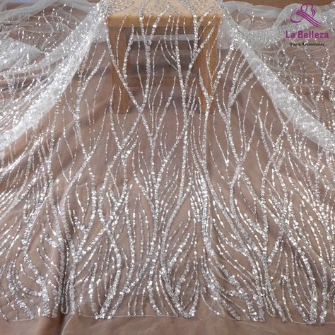 Price: The price is for 1 yard. if you buy more than 1 yard,it won't be cut. will come in one piece the longest is 20 yards. Material: polyester, sequins, beads Fixed Wide : 130cm or 51 inches. color:Off white Want to see other colors and more similar Beading lace fabrics come to: https://www.etsy.com/shop/Randyfabrics?ref=hdr_shop_menu&section_id=14192305 Shipping: Choose the shipping way you need, if you want package shipped by express,please note the phone number on order. Use for Dress,c Wedding Gown Materials, Sequin Fabric Dress, Sequin Pattern Design, Beaded Lace Pattern, Wedding Dress Material Fabrics, Lace Material Fabrics, Beaded Fabrics, Sequence Fabric, Couture Beading